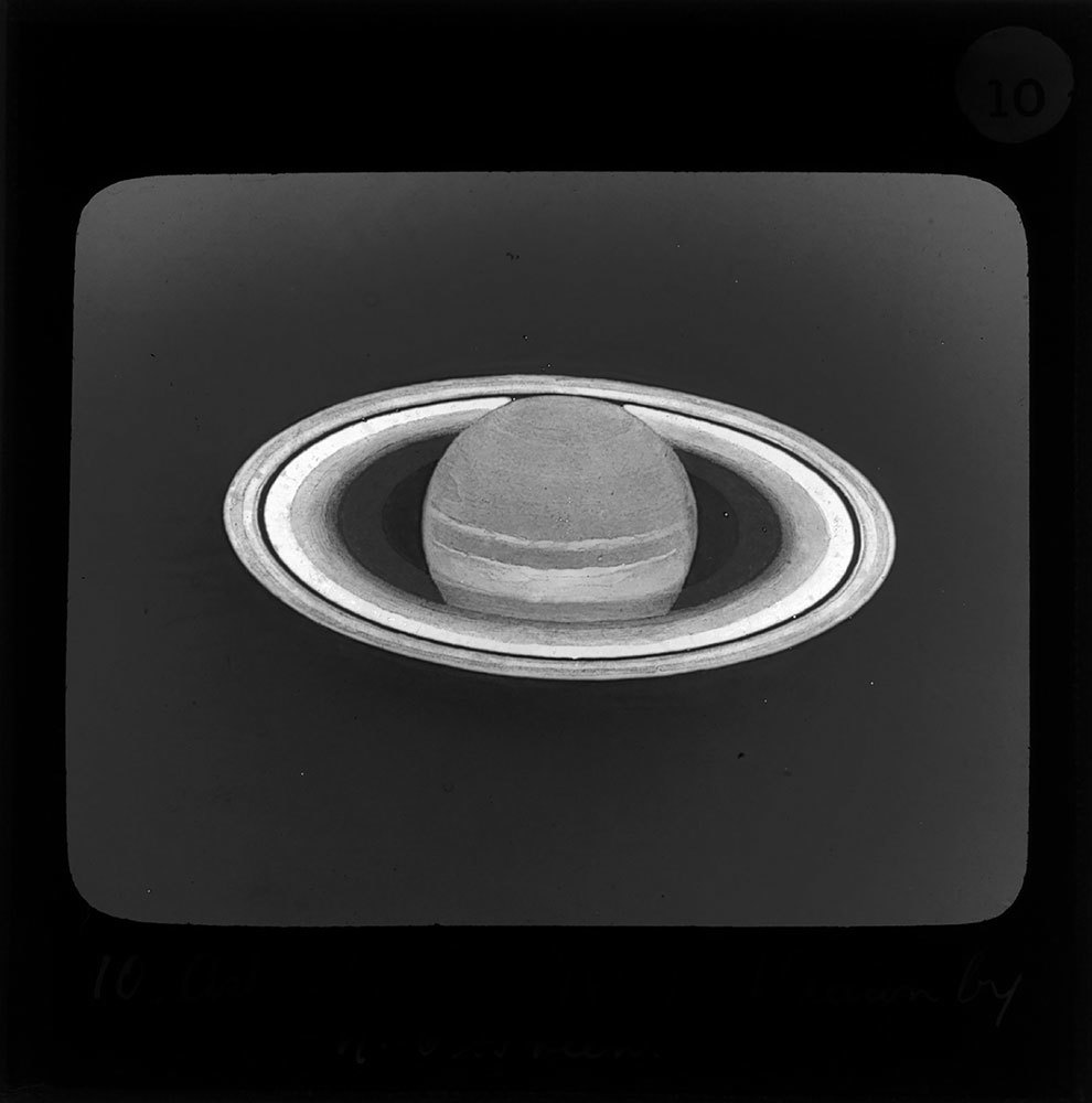 A black and white picture of the planet Saturn with its rings