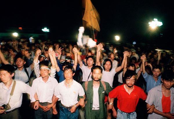 Pro-democracy students march through Tiananmen Square in Beijing to demand more democratic rule in Communist China.