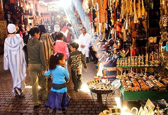 Light beams strike a display of arts and crafts at a market stall in Marrakech, Morocco.