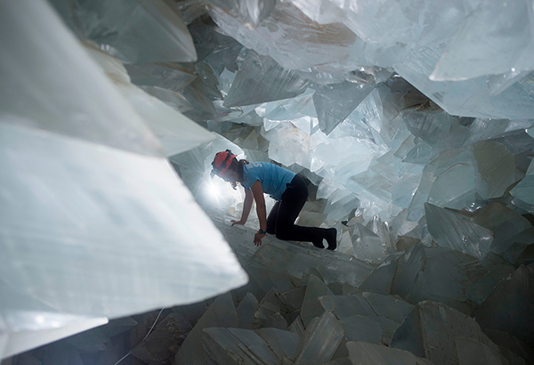 Geologist Milagros Carretero maneuvers through the gigantic Pulpí Geode in Spain in August 2019.