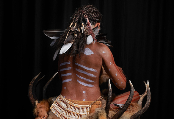 Archaeologists determined she was buried seated upright. A belt featured teeth from deer, wild boar, and moose, while her cape was fashioned from crow, magpie, gull, jay, goose, and duck feathers.