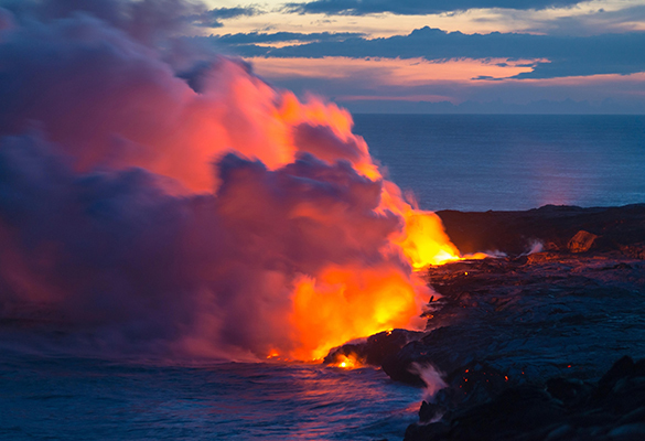 Steam rises as lava pours into the Pacific Ocean on the Big Island of Hawaii.