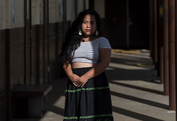 Carolann Carl, a Pohnpeian storyteller, poses in the halls of Washington Middle School in Honolulu.