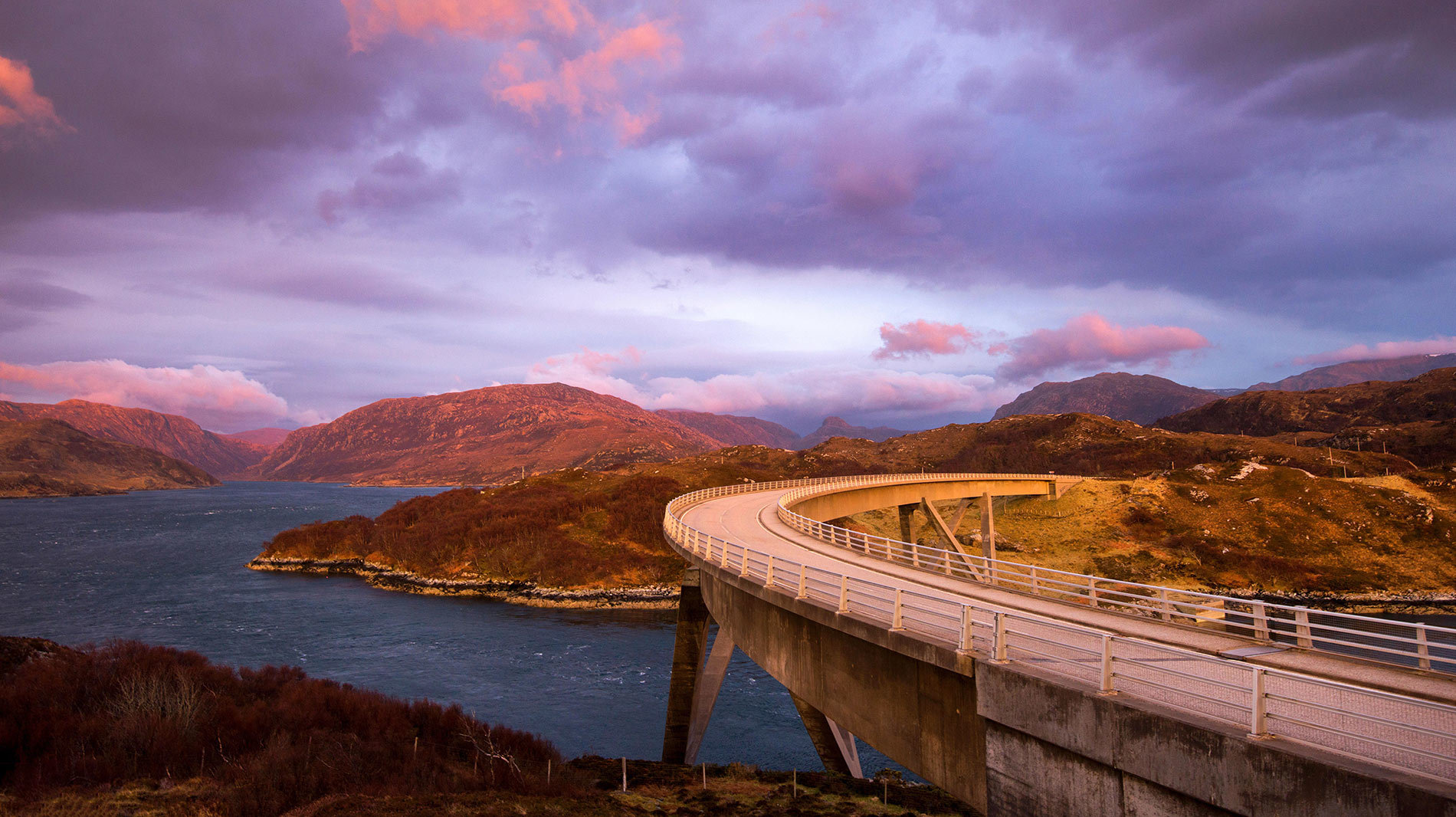 The Kylesku Bridge crosses Loch a' Chairn in Sutherland, Scotland.