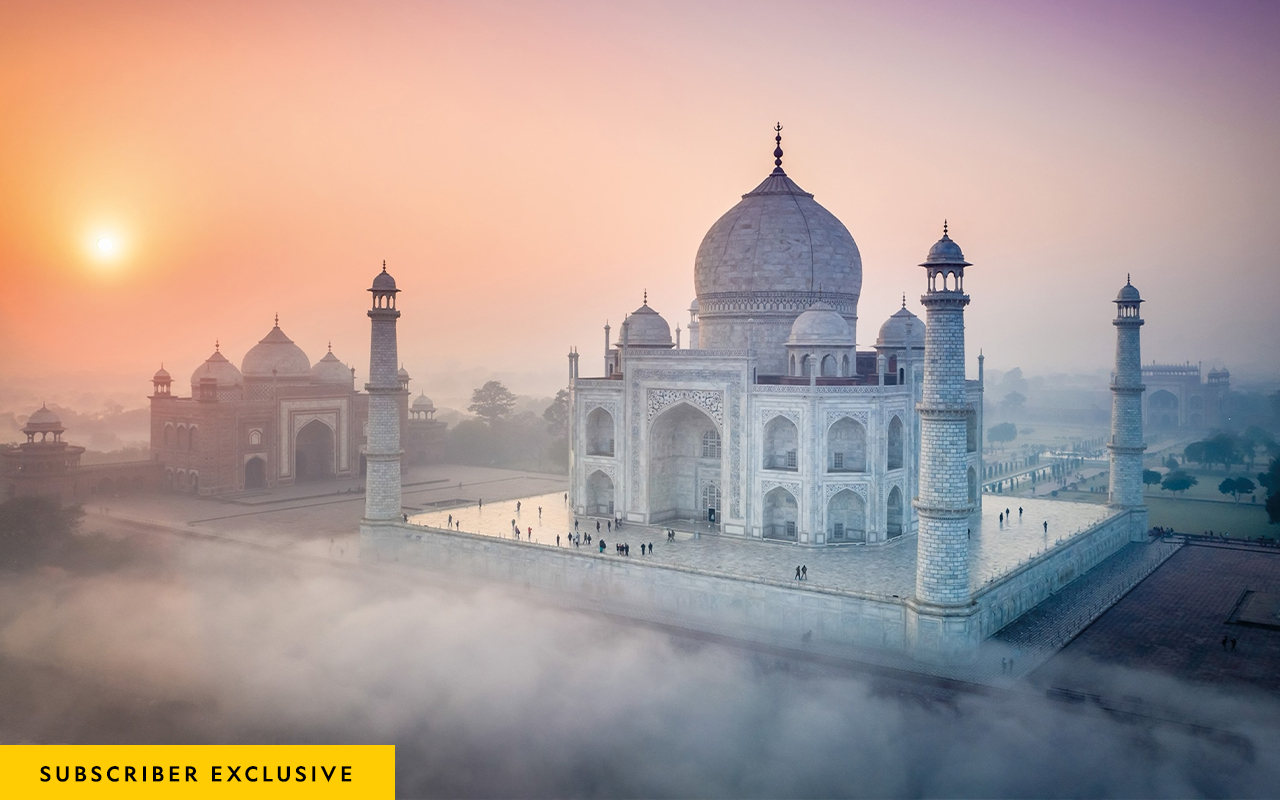 The marble of the Taj Mahal changes color as the light falling on it brightens and fades throughout the day. In this image, taken at sunrise, the building takes on a rosy hue.