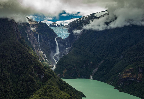 Waterfalls cascade from a hanging glacier in Quelat National Park, a spectacular stop along Chile’s Route 7—also called the “Carretera Austral”—which winds through Patagonia.