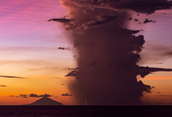 Lightning snakes through a volcanic plume, obscuring Anak Krakatau from sight during an eruption in January 2019. This image was taken just two weeks after a flank collapsed on the volcano, sending a tsunami crashing onto nearby coasts and marking the start of a six-day-long volcanic thunderstorm.