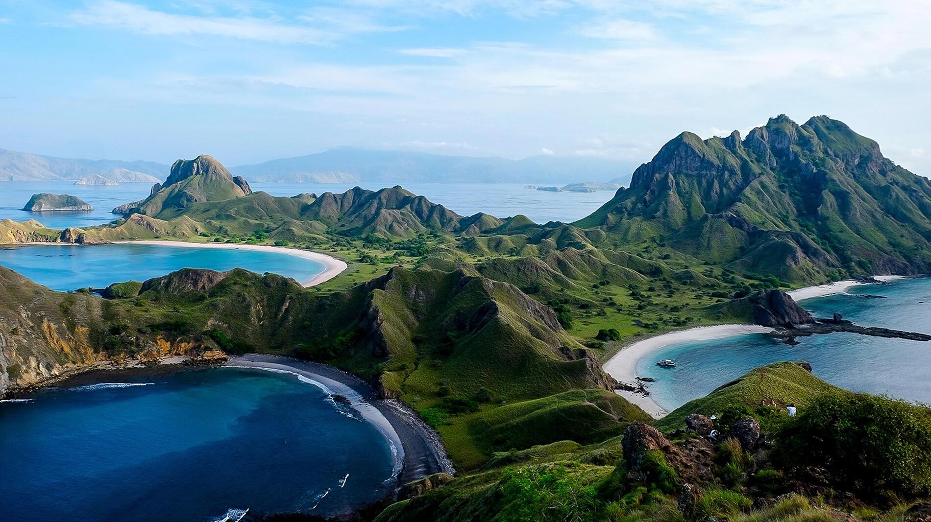 In Komodo National Park, Padar Island features three colored-sand beaches: pink, black, and white.