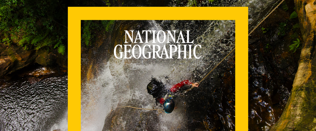 National Geographic - A person rappels down a raging waterfall.