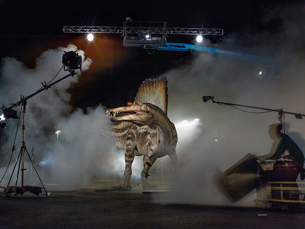 A model of the Cretaceous predator Spinosaurus gets rock star treatment at a photo shoot.