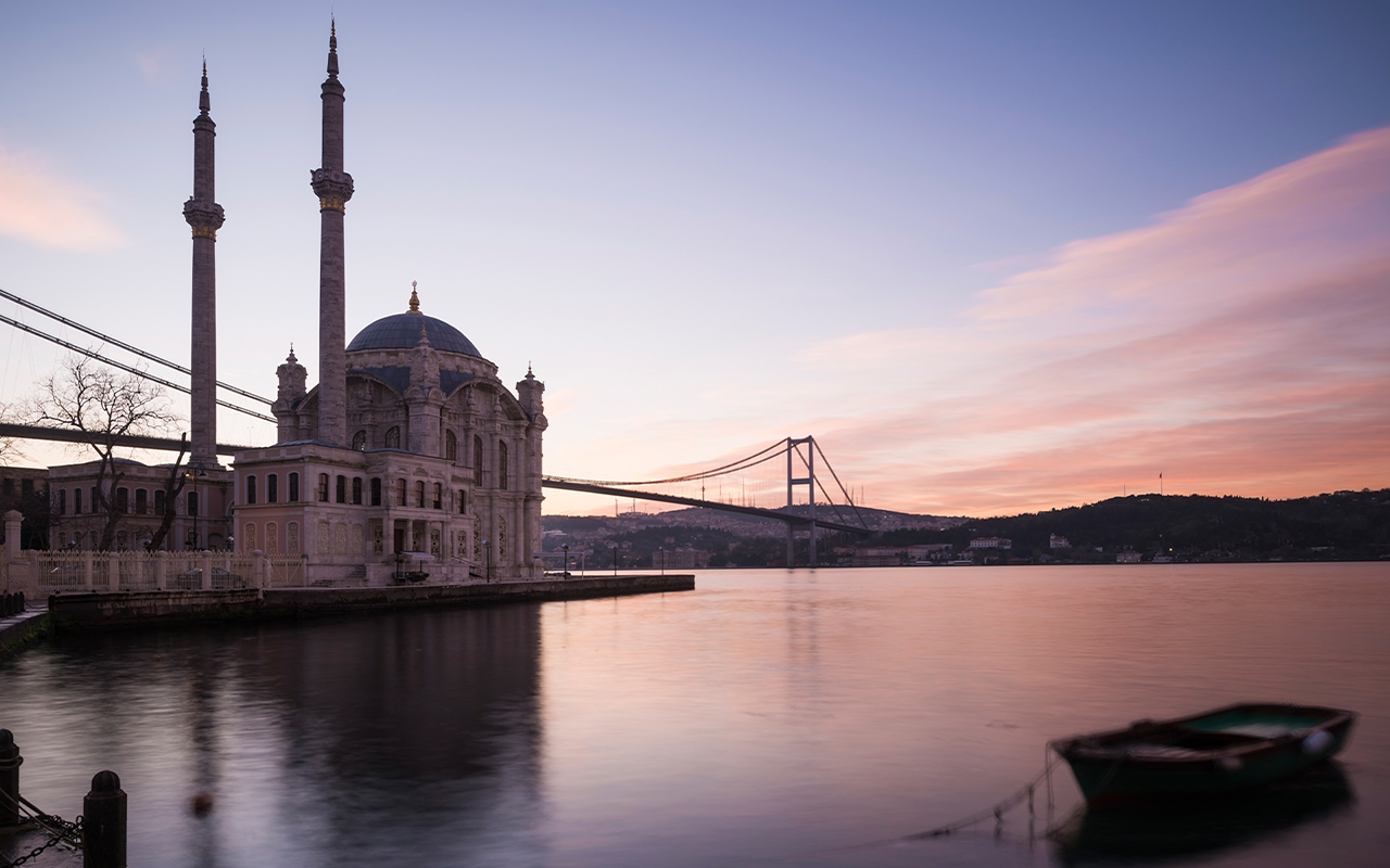 Dawn casts a rosy glow on Ortakoy Mosque in Istanbul, Turkey.