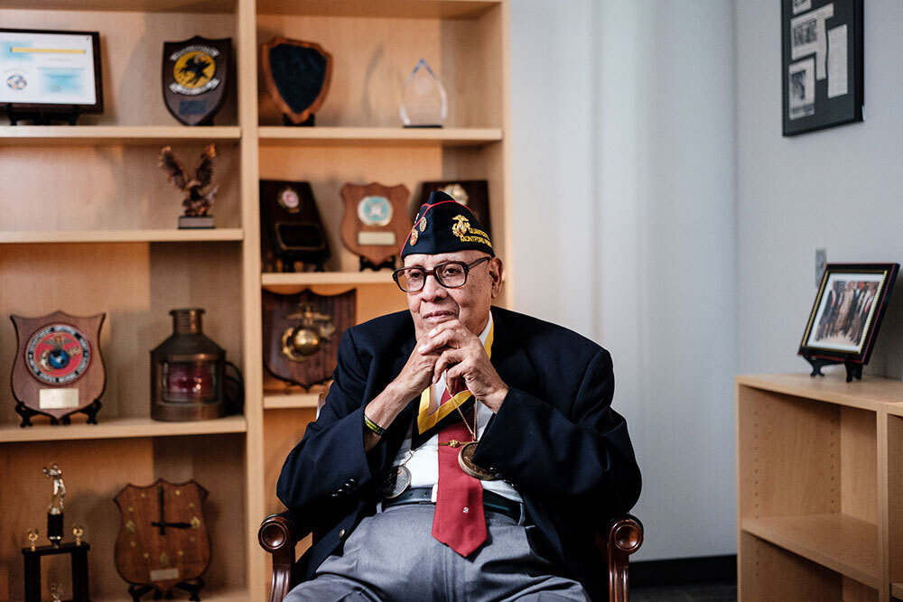 A portrait of a seated man wearing medals