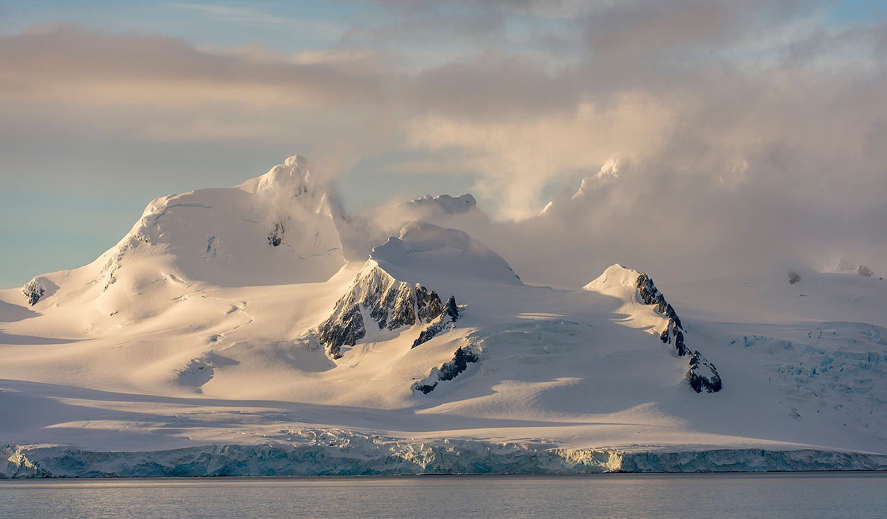 A new way to study Antarctic ice from space is giving scientists a precise look at how much snow falls there. Here, Livingston Island, off the coast of Antarctica, looms in the distance.