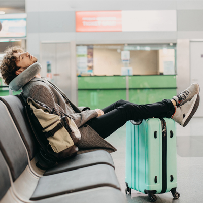 A traverler sleeping in an airport