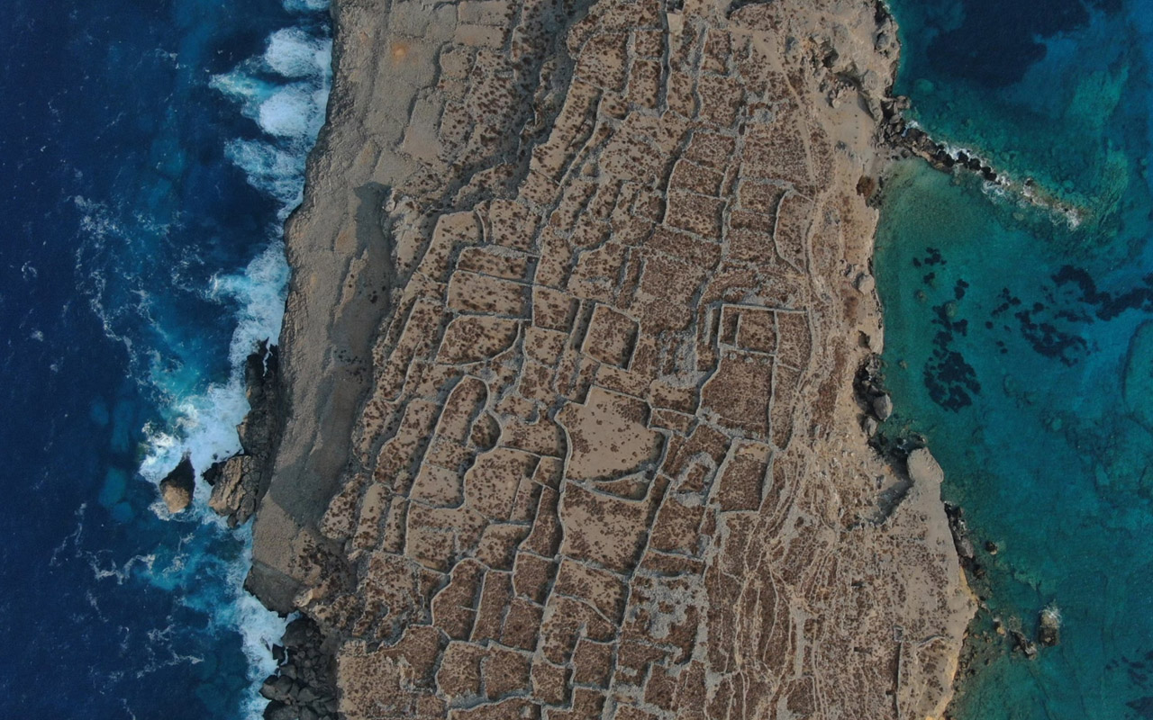 The Greek island of Karpathos, a growing center of ecotourism, features striking landscapes surrounded by the Aegean Sea.