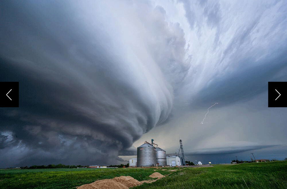 storm swirling over farm elevator