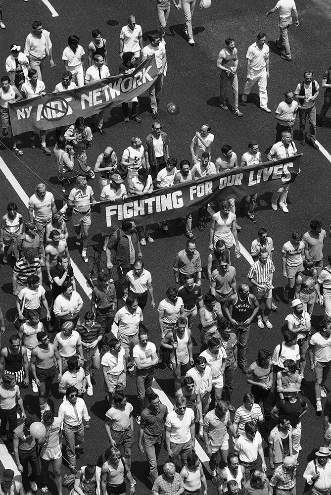 people march in a pride parade