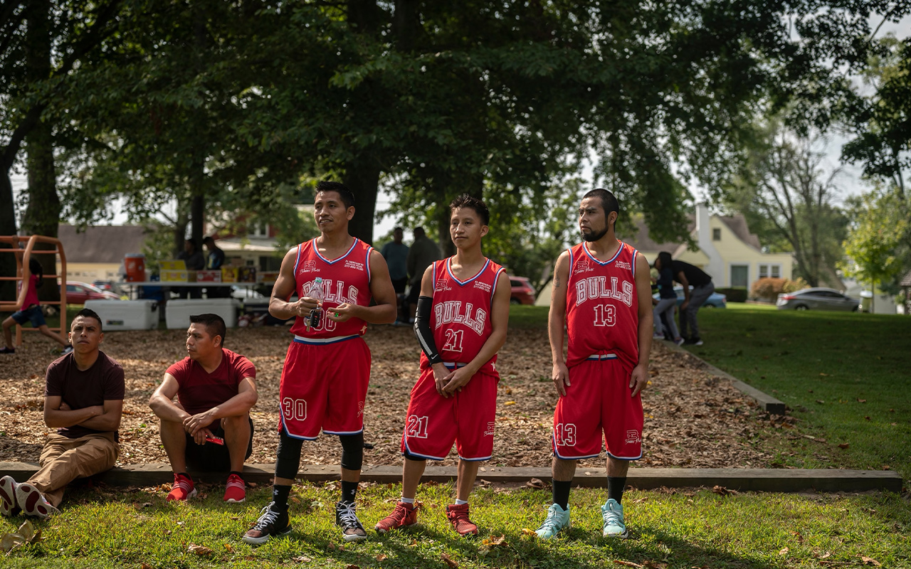 All the participants in a September basketball tournament in Seymour, Indiana, are members of the local Chuj community, Indigenous migrants from Guatemala. Jamie Vicente, Filipe Miguel, and Diego Martin play for Los Bulls from Rantoul, Illinois.