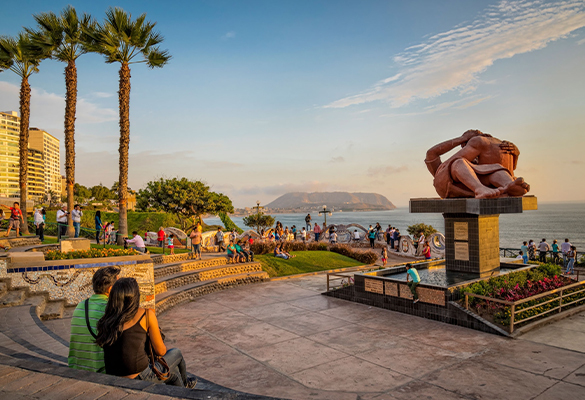 A couple sits at the Parque del Amor on El Malecon in Lima.