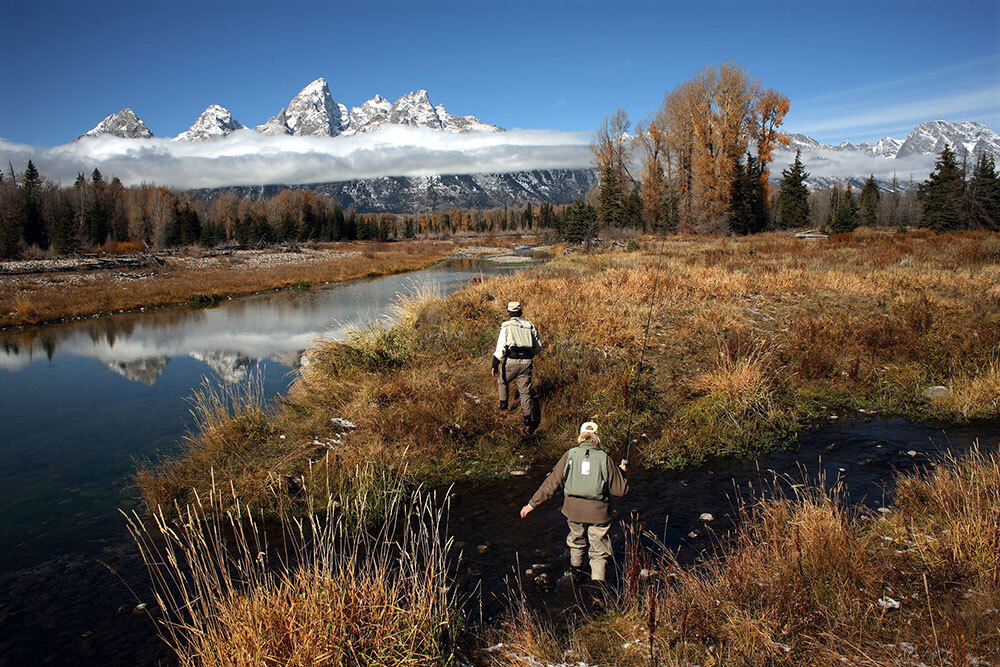 two people walk in Grand Teton National Park