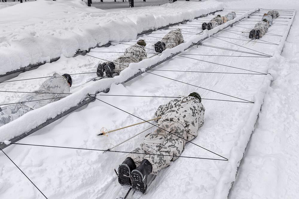 At a military facility north of the Arctic Circle, Finnish and U.S. soldiers train for winter warfare by navigating an obstacle course while on skis.