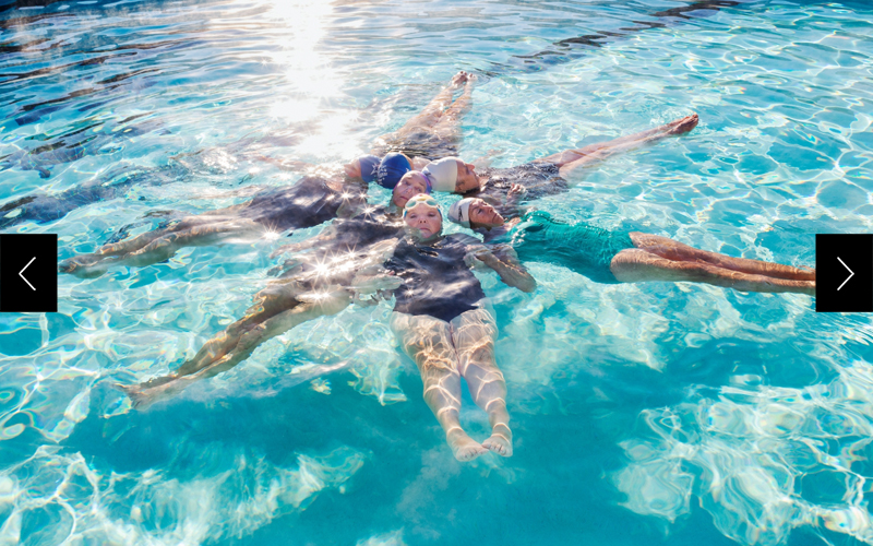 Swimmers from the Aqua Suns synchronized team form a star shape while rehearsing for a 2013 holiday show at the Lakeview Recreation Center.