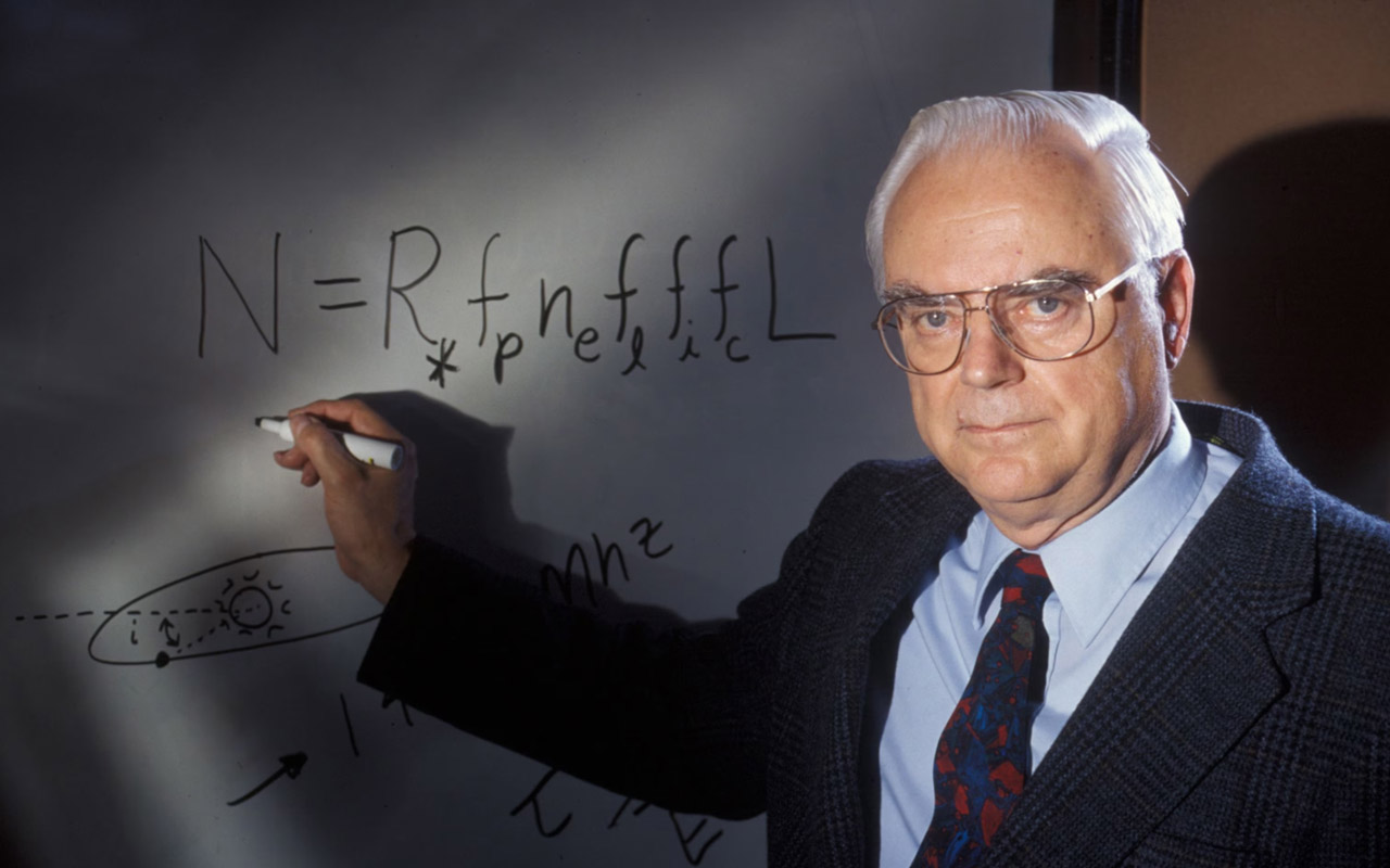 Frank Drake stands in front of a whiteboard with his eponymous equation, which estimates the number of detectable alien civilizations in the Milky Way galaxy.