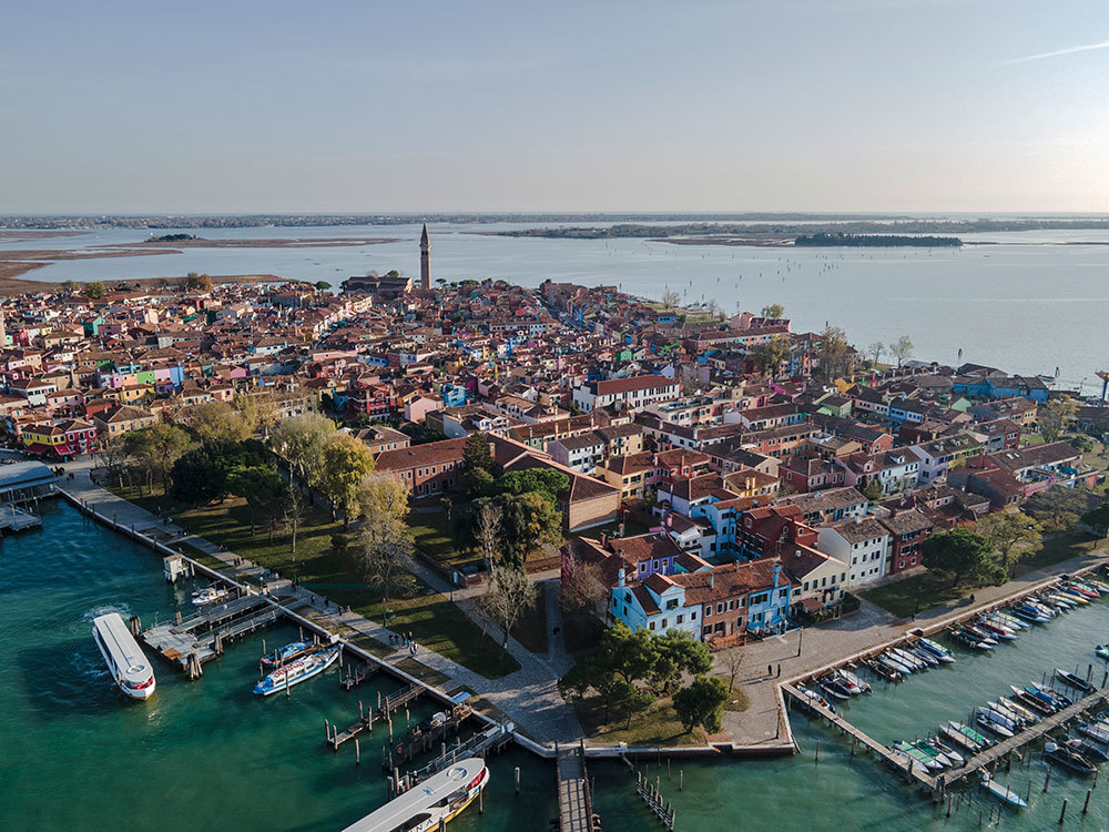 An aerial photograph of a town surrounded by water