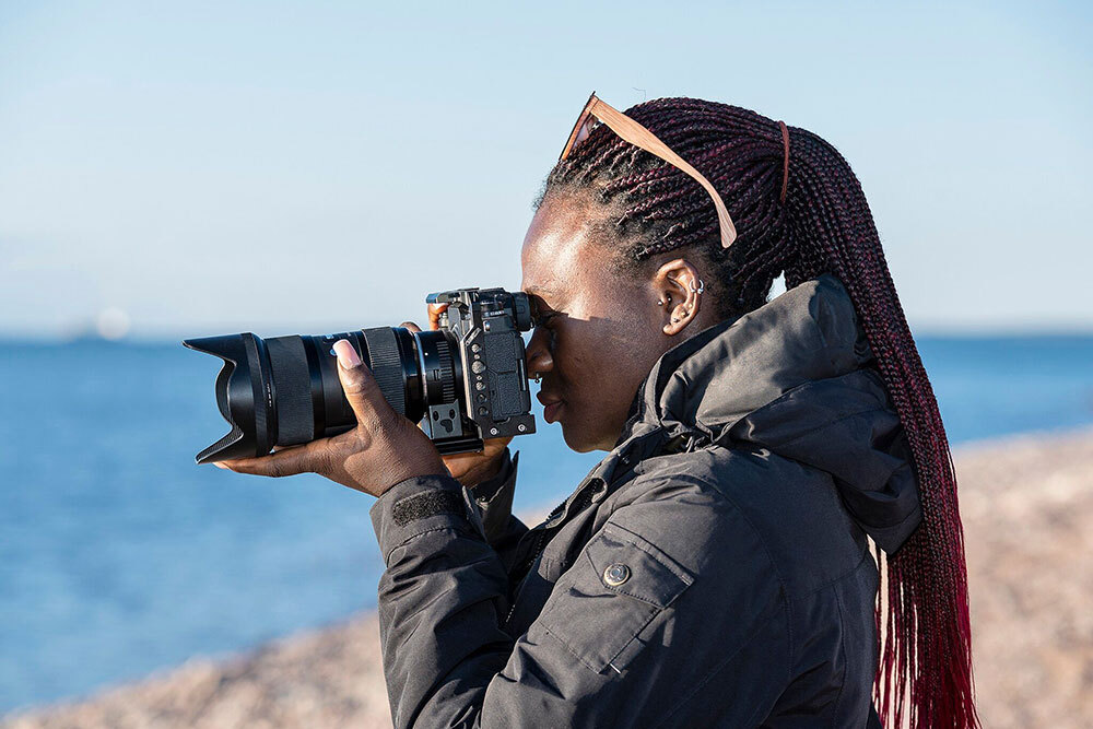 A woman takes a photograph