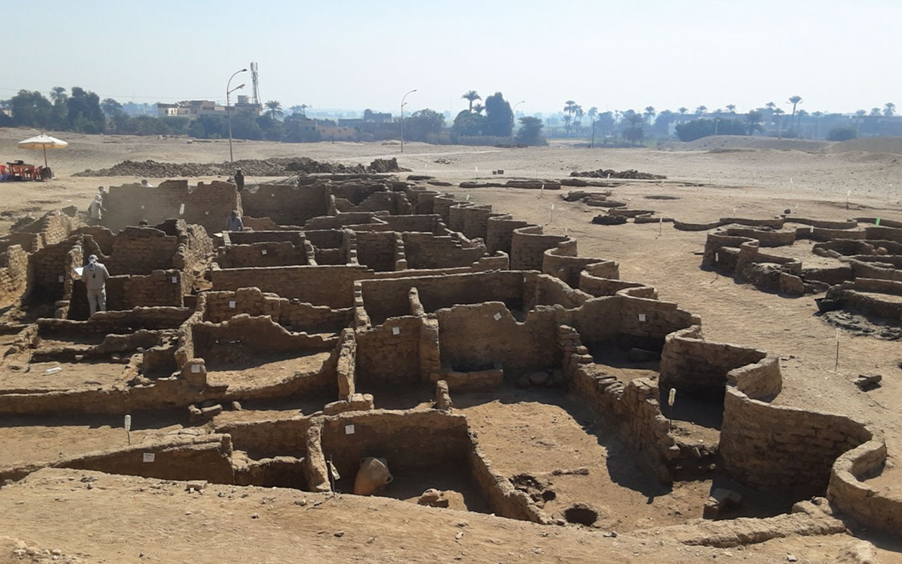 Mudbrick walls of the 3,400-year-old city, shown here enclosed by a distinctive “zig-zag” wall, stand some nine feet high in areas.