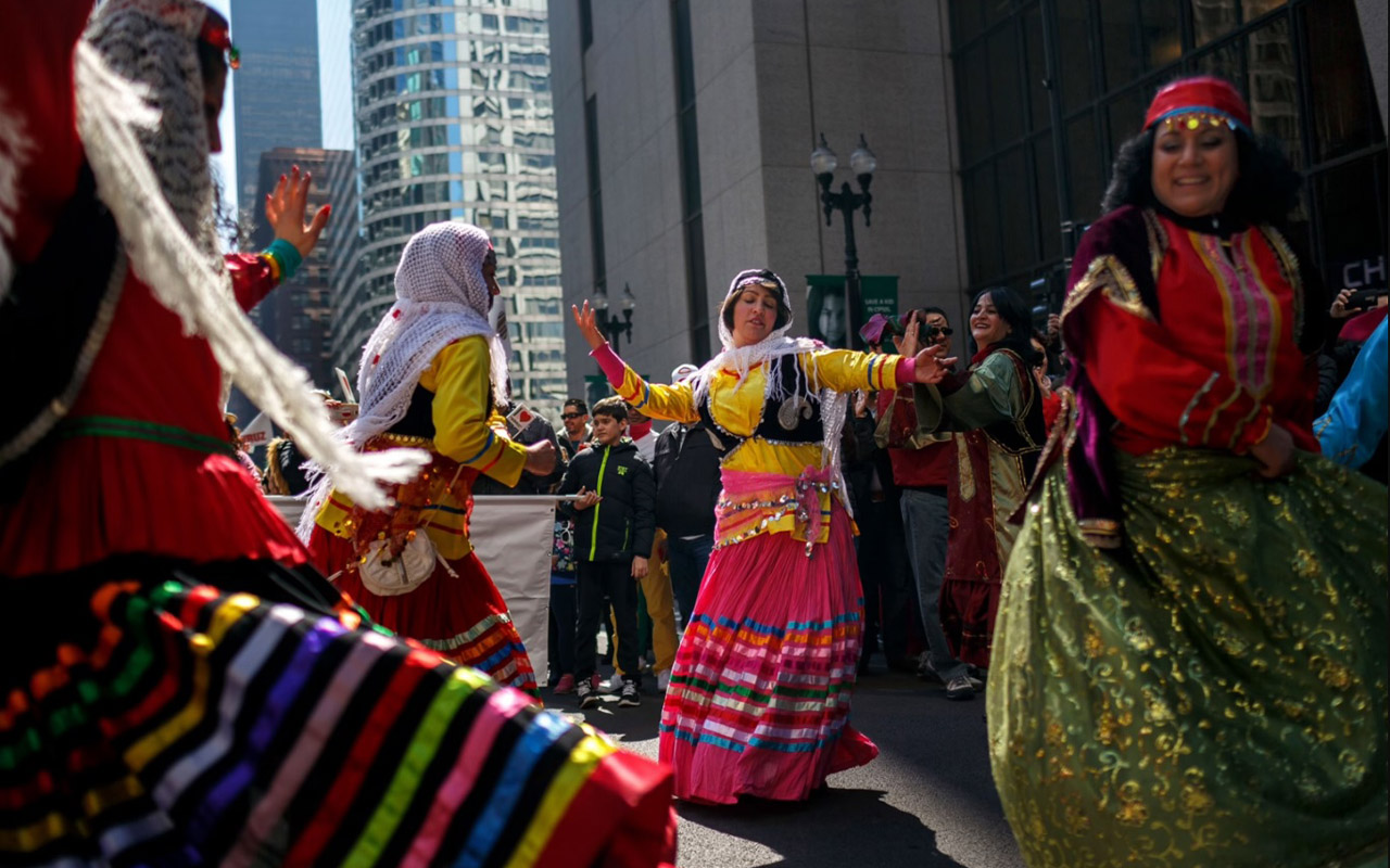 People dancing in traditional dresses in downtown Chicago