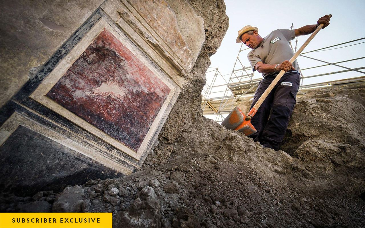 A worker removes volcanic fragments (lapilli) from the atrium of the House of Orion in Pompeii’s Region V. The decoration being uncovered is characteristic of the so-called First style (200-80 B.C.).