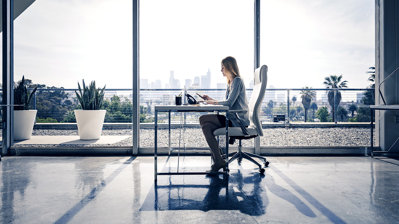 Photo of a person sitting at a desk.