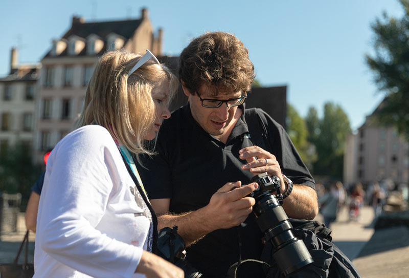 A National Geographic Expert shares photography tips with a guest.