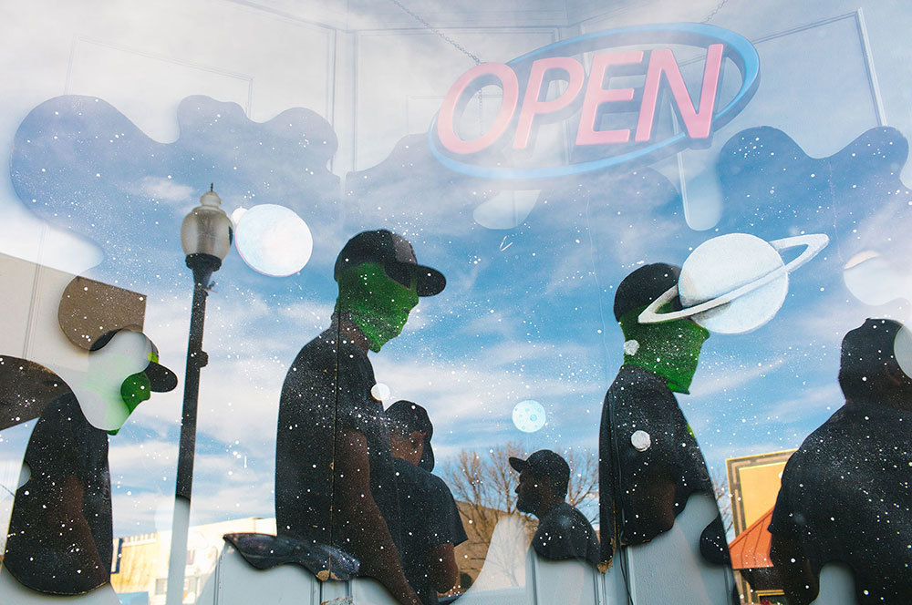 A picture of people wearing alien masks