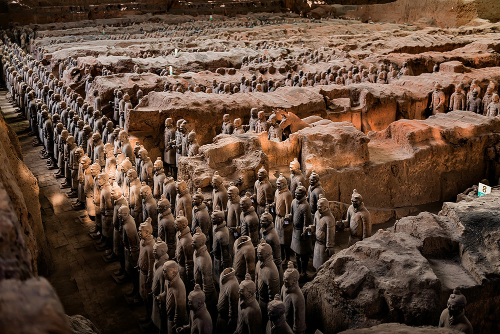 Statues of warriors fill pits in the ground