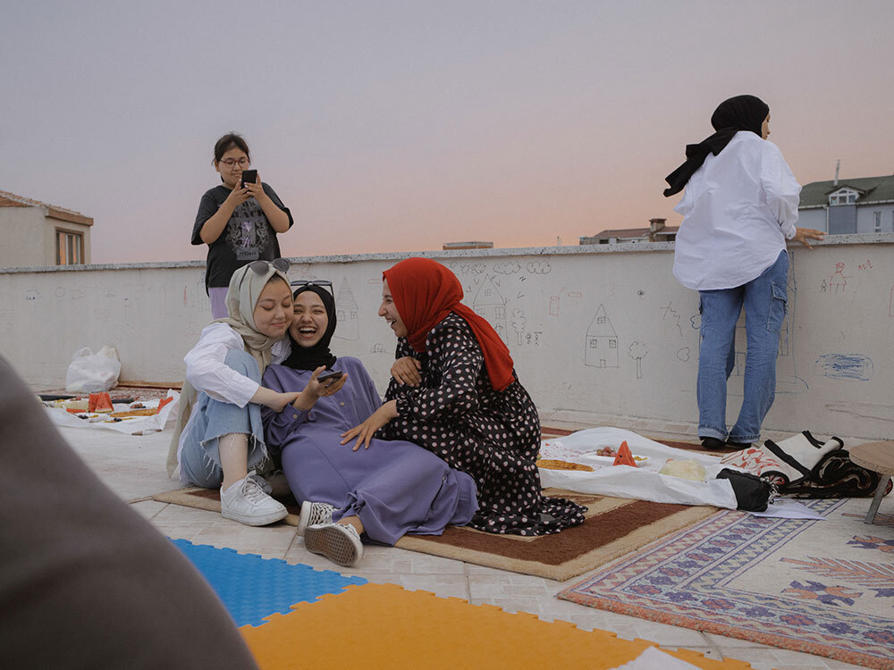 A group of girls laugh together