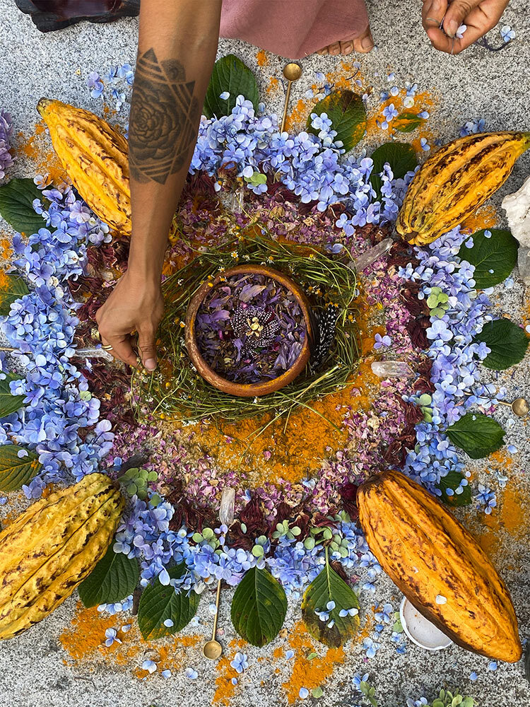 A mandala offering made from herbs, flowers, and gifts from the earth.