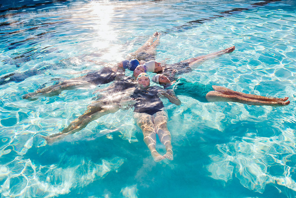 Swimmers from the Aqua Suns synchronized team