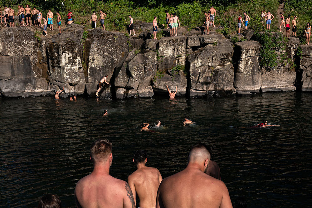 people swim in a river