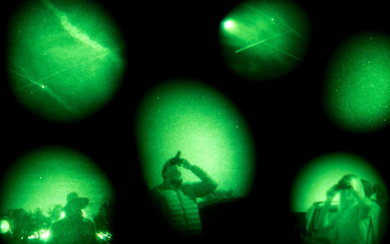 UFO believers look for suspicious spacecraft during a UFO and Vortex Tour in Sedona, Arizona. This composite image is a combination of six photographs taken in 2017 through night vision goggles.