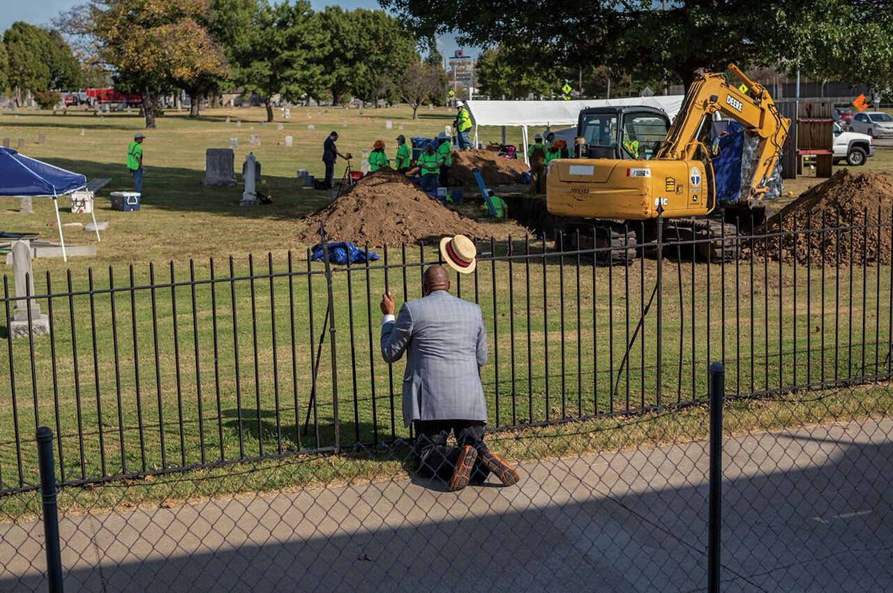 Robert Turner prays near the site of a newly discovered mass grave in Tulsa’s Oaklawn Cemetery, the first found from the 1921 attack by white rioters on Greenwood, a Black neighborhood. Turner is pastor at Vernon African Methodist Episcopal Church, which was heavily damaged in the rampage.