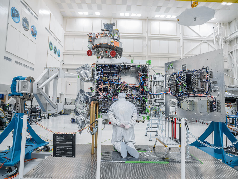 A technician studies the vault or “brains” of NASA’s Europa Clipper spacecraft, which is being assembled at the Jet Propulsion Laboratory in California and will launch next year.