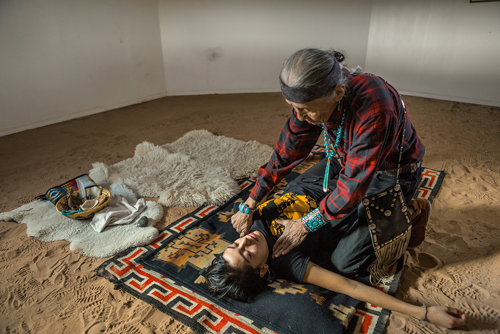 A healer treating the body and mind of a patient to relieve her pain and stress