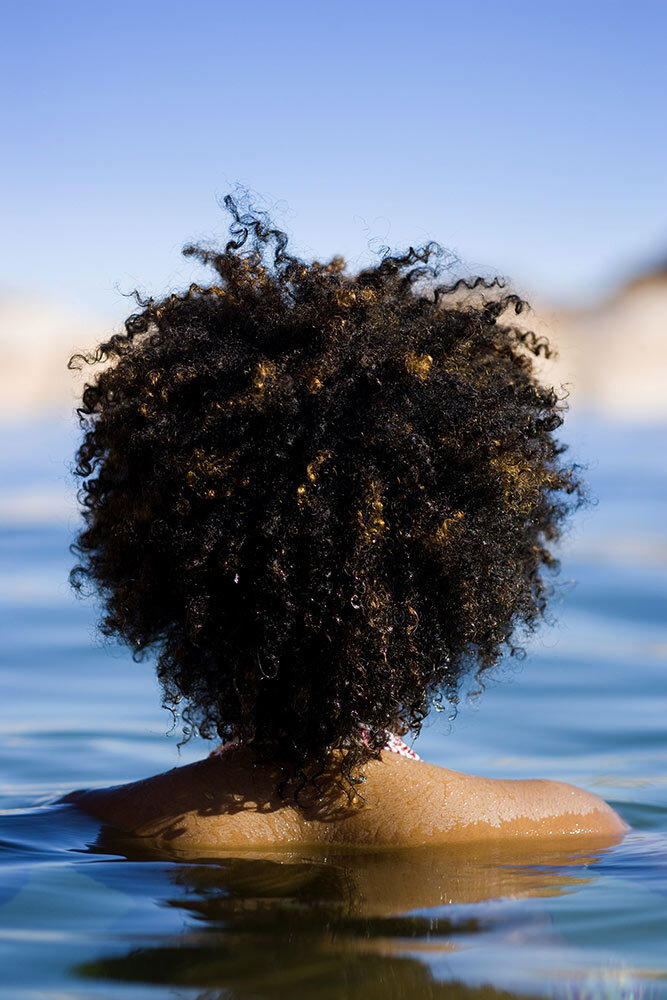 A curly-haired woman