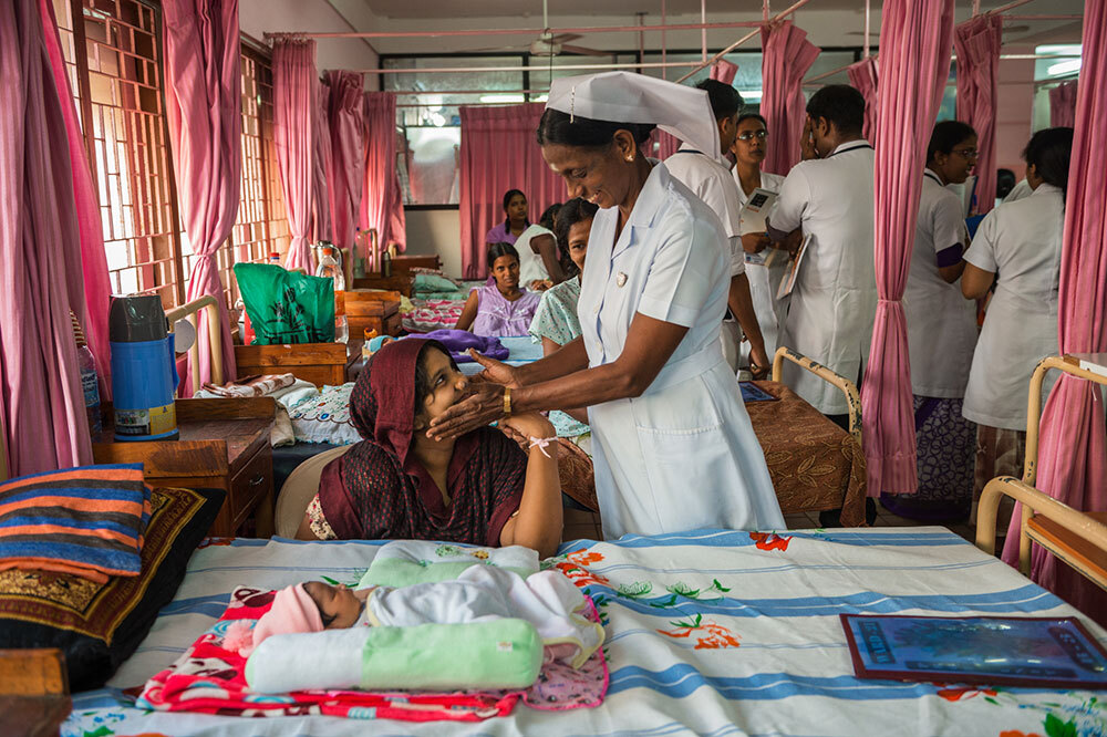 a nurse greets a new mother