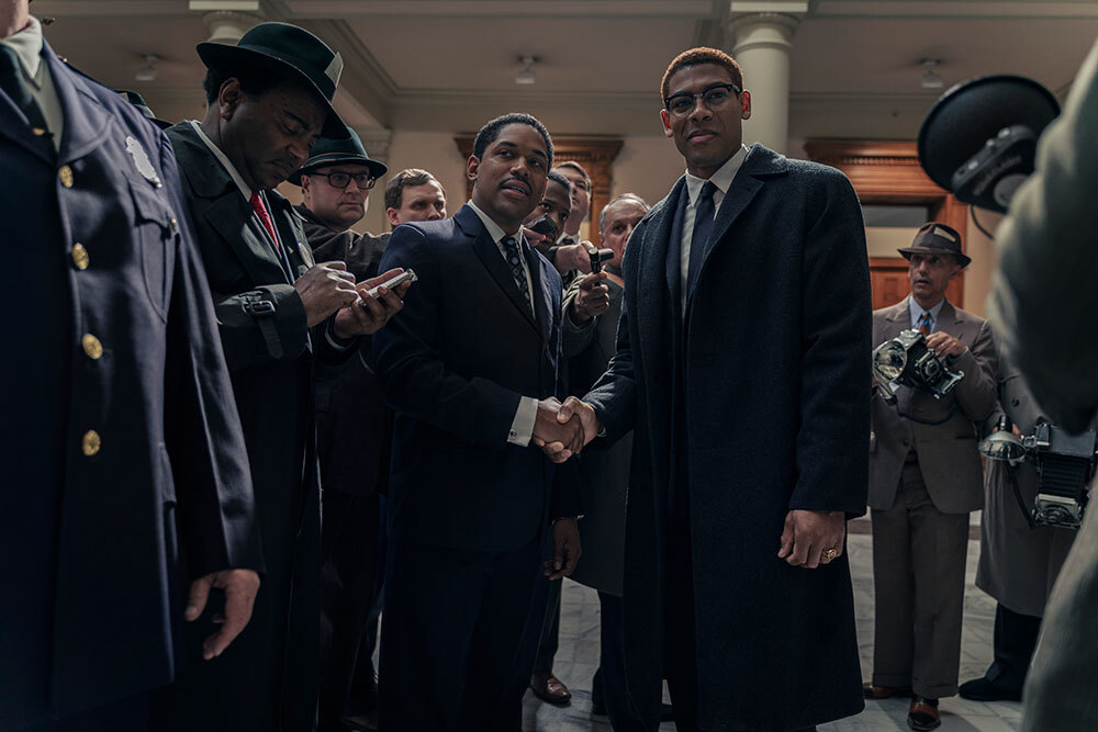 Martin Luther King Jr., played by Kelvin Harrison Jr., and Malcolm X, played by Aaron
Pierre, are surrounded by reporters in the US Senate as seen in GENIUS: MLK/X.