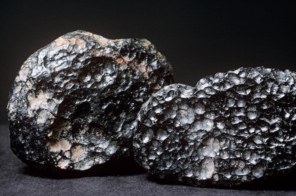 Tektites are silica-rich pieces of natural glass, thought to form when a meteorite impacts a sandy part of Earth.