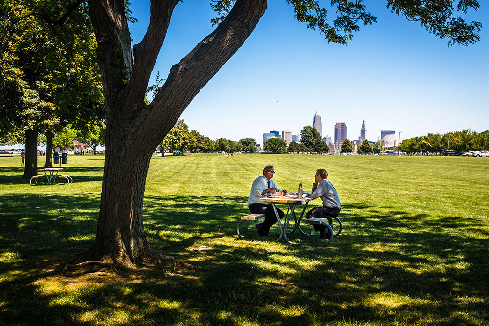 Two men sitting at a picnic table in Cleveland, Ohio