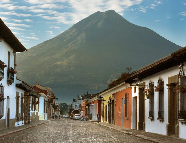 Volcán de Agua (Water Volcano) rises above Antigua's colorful colonial homes.